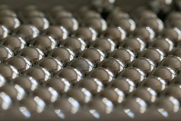 Metal sling balls arranged in rows, balls for bearings.
