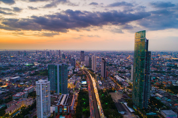 Fototapeta na wymiar Aerial view Bangkok building with river sunset