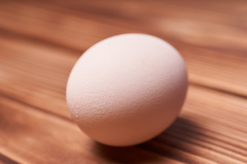 Chicken eggs laid on a wooden table
