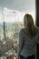 Girl on Window with melbourne Skyline view city