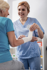 Nice good looking woman talking to her patient