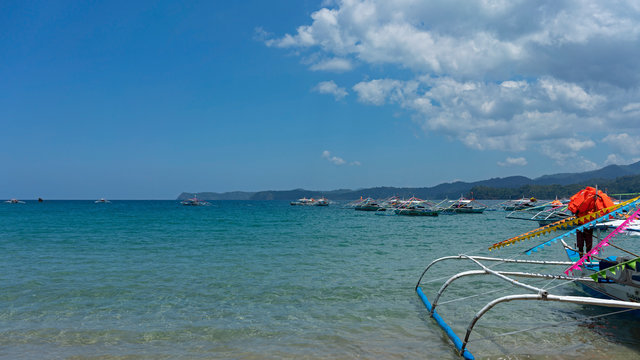 Paraws, double outrigger boats used in hauling tourists to the mouth of underground river in Palawan, UNESCO World Heritage Site as well as well as New7Wonders of Nature.