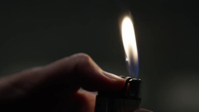 hand large ignites the lighter