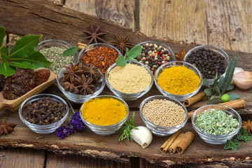 Variety of spices on wooden background