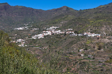 Fototapeta na wymiar Gran Canaria,view of mountain countryside and village of Tejeda, white Canarian houses with brown clay roof tiles. Canary Islands, Spain