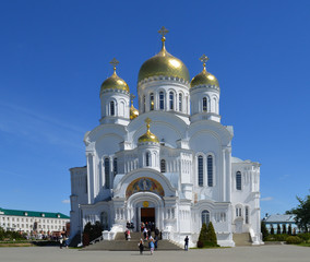 Fototapeta na wymiar white stone Church for people's prayers on a Sunny day in summer