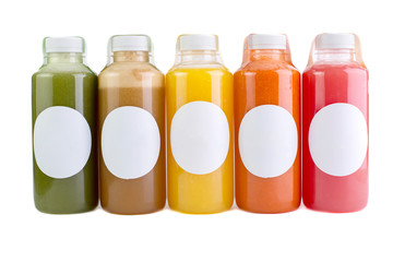 Colorful juices, smoothies, milkshakes in plastic bottles isolated on white background, top view. - Image