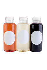 Colorful juices, smoothies, milkshakes in plastic bottles isolated on white background, top view. - Image