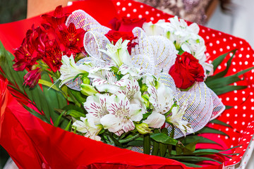 Bouquet from white and red lilies flowers