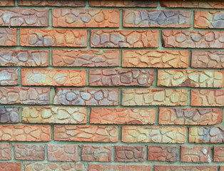 cement wall made of multi-colored bricks for design solutions
