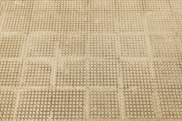 Old beige stone pavement background texture