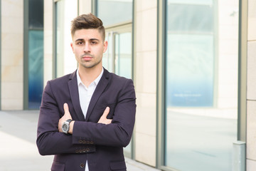 Fototapeta premium Portrait of successful businessman open in modern city near business center