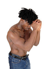 Fototapeta premium Close up of a black man flexing his muscles with his hands on face