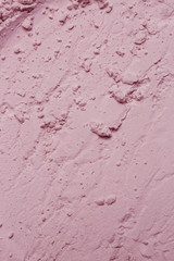 Pink cosmetic clay powder textured background, close up,