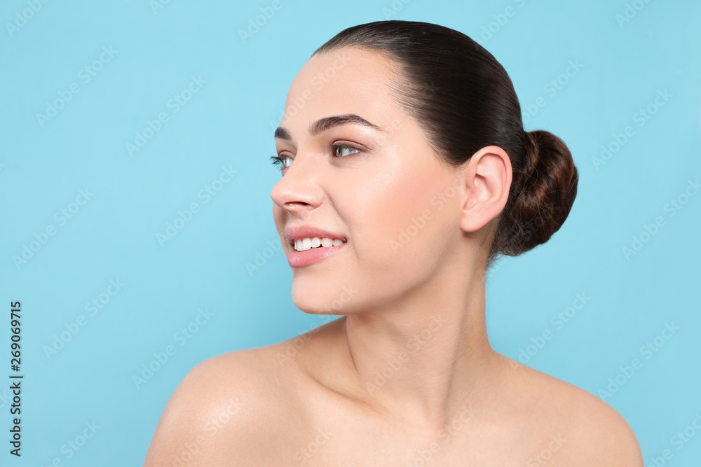 Sticker Portrait of young woman with beautiful face and natural makeup on color background