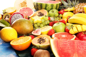 Tropical fruits background, many colorful ripe fresh tropical fruits