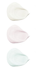 Face cream samples on white background