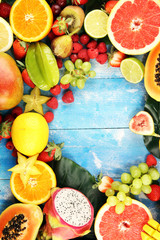 Tropical fruits background, many colorful ripe fresh tropical fruits