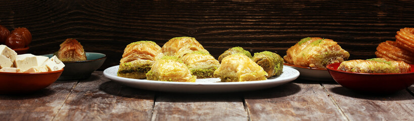 Middle eastern or arabic dishes. Turkish Dessert Baklava with pistachio on dishes
