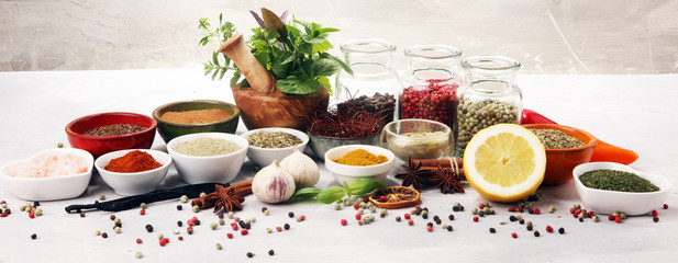 Spices and herbs on table. Food and cuisine ingredients with basil