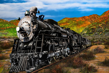 Vintage coal burning steam engine carrying freight along the desert landscape.