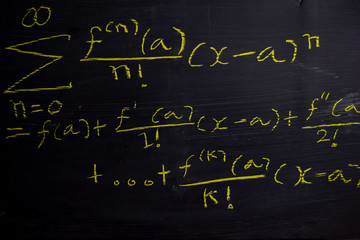 Fototapeta na wymiar Close up math formulas written on a blackboard. Education concept