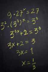 Close up math formulas written on a blackboard. Education concept