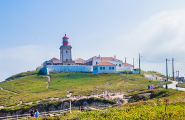 Fototapeta na wymiar Cabo da Roca lighthouse (Portugal) is on top of the cliff. Construction of the lighthouse was completed in 1772