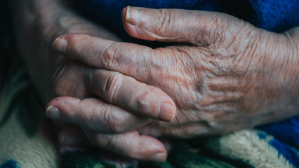 Fototapeta premium old senior woman hands with veins. risk group coronavirus or covid virus. risk group coronavirus or covid virus