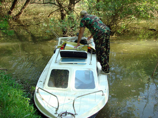 Fishing from the boat on a wild water