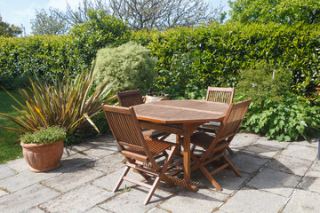 Terrace and wooden garden furniture in a garden during spring - 269077182