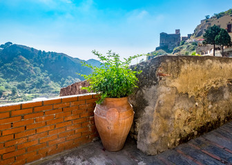 View Sicily with wall and vase