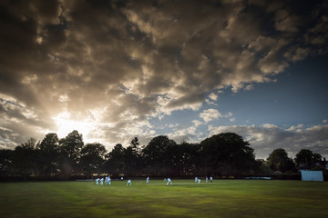 English Cricket match tiny figures big sky