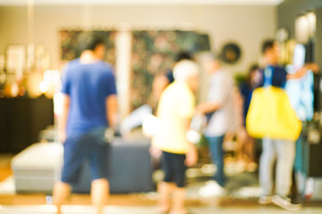 Blurred group of business people walking in shopping mall