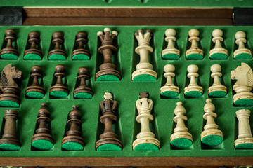 Obraz premium black and white chess pieces in box chessboard, business strategy concept