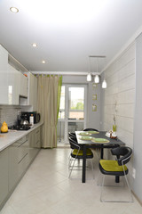 Interior of modern kitchen with a stretch ceiling