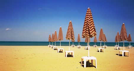 Beach Brollies on a deserted beach