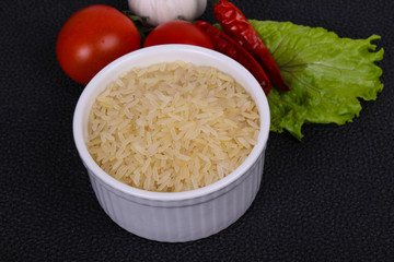 Raw uncooked rice in the bowl