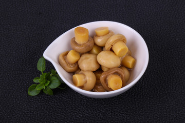 Pickled champignon heap in the bowl