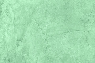 Trendy Neo mint colored low contrast Rough Concrete textured background to your concept or product....