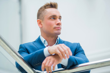 handsome young man in a suit indoors