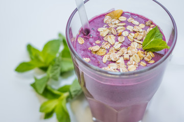 Berry smoothie with blueberry, blackberry and homemade yogurt fitness cocktail with blueberries and oatmeal.Healthy food concept. Sport, diet and fitness drinks concept.