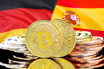 Concept for investors in cryptocurrency and Blockchain technology in the Spain and Germany. Bitcoins on the background of the flag Spain and Germany.