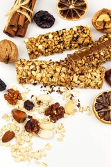 Muesli bar on a white background. Healthy food. Protein diet. Healthy sweetness. Oatmeal and dried fruits.