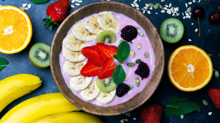 Yogurt smoothie bowl. Vegetarian healthy food (berries, yogurt, muesli, fruit)