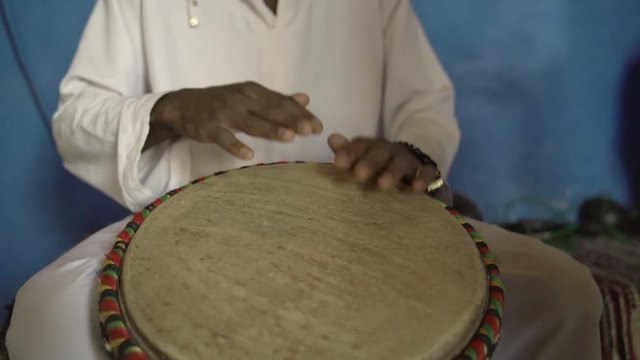 Percussionist playing bata drums in Africa