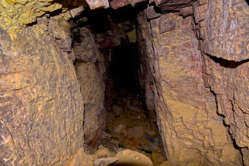 Abandoned to the Darkness. An abandoned mineshaft in the side of Sullivan Butte in Chino Valley AZ. For safety reasons I did not fully explore the mine.