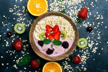Yogurt smoothie bowl. Vegetarian healthy food (berries, yogurt, muesli, fruit)