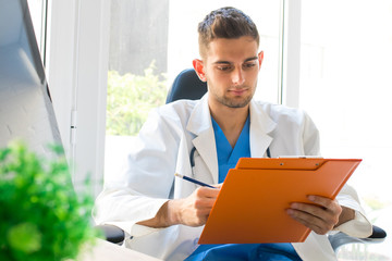 doctor in consultation with documents or reports