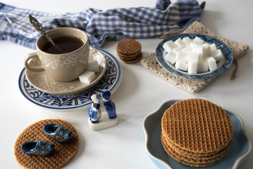 traditional Dutch stroopwafel, syrup cookie, with tea and Delfts blue souvenir